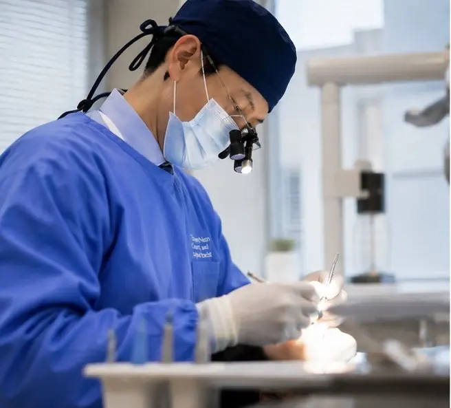 Dr. Edward Nam performing implant surgery at ID Dental Implant Center Koreatown